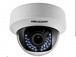 Dome security camera with motorized lens
